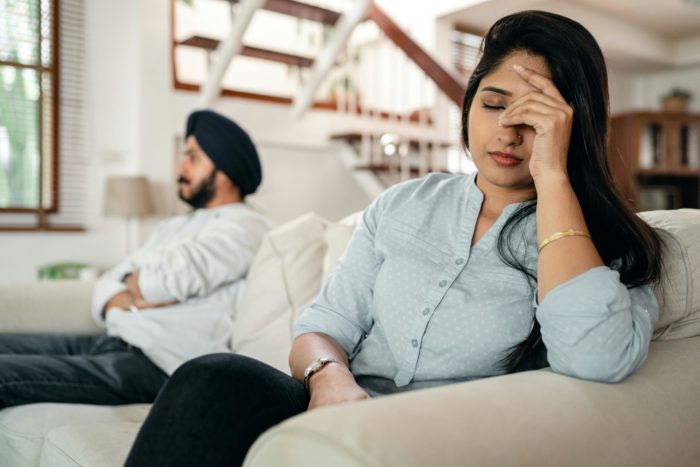 Image depicts a couple in the context of Understanding the psychological impact of divorce and how to cope